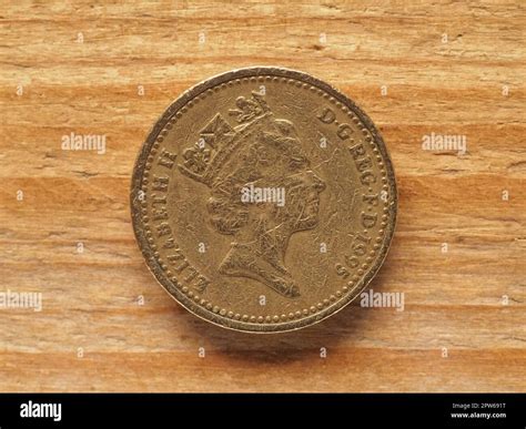 LONDON, UK - CIRCA 2022: one pound coin obverse side showing a portrait of the Queen Elizabeth ...