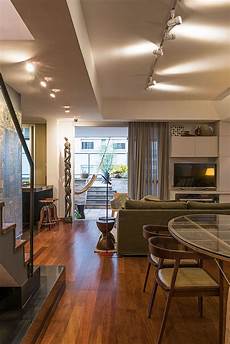 Penthouse Interior Design With Orange Accents by 50s Dcor Meets Modern Flair Inside Rejuvenated Penthouse Interior Design With Orange Accents