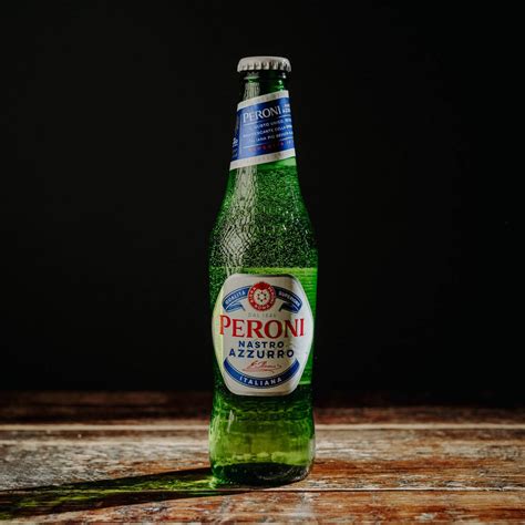 Download Lone Bottle Of Peroni Beer On A Black Background Wallpaper ...