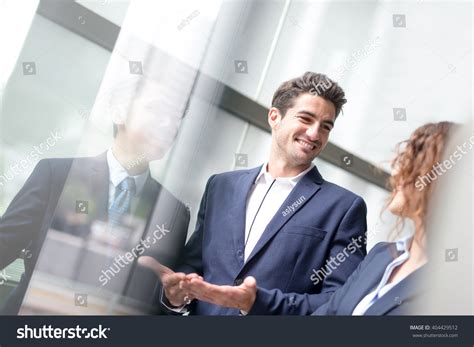 Group of People Standing in Office Pointing 的图像结果