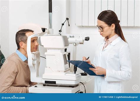 Side View of Patient Getting Eye Examination in Slit Lamp Stock Photo ...