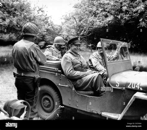Vintage World War II photo of General Dwight D. Eisenhower sitting in a jeep talking with other ...