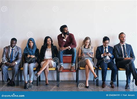 Standing Out of the Crowed. a Group of Confident Businesspeople Waiting ...