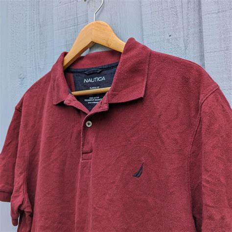 Nautica Burgundy Polo T-shirt Good overall... - Depop