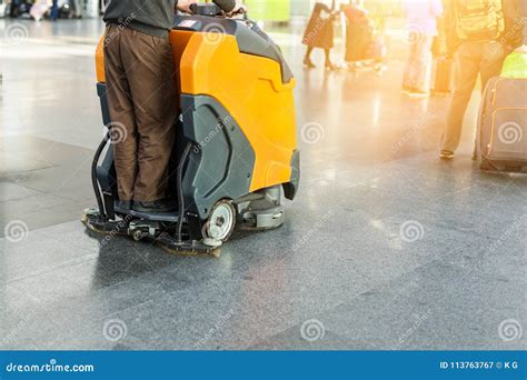 Man Driving Professional Floor Cleaning Machine at Airport or Railway ...
