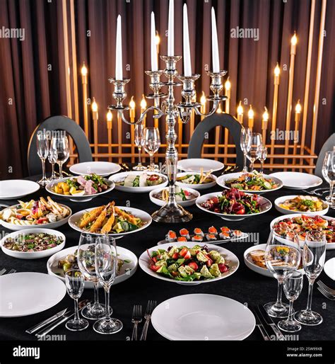 Elegant dinner table setup with gourmet dishes Stock Photo - Alamy