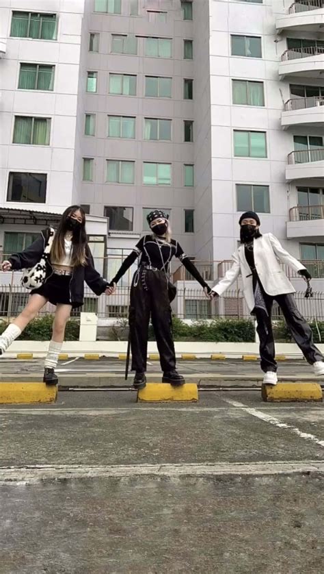 Download Three Friends In Parking Lot Picture | Wallpapers.com