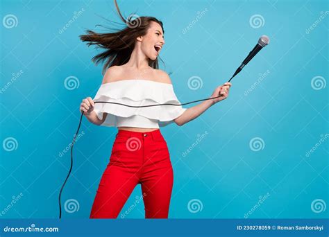 Photo of Charming Shiny Young Lady Wear Off-shoulders Shirt Singing ...