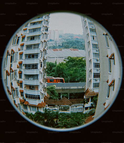 A view of a building through a fish eye lens photo – Red Image on Unsplash