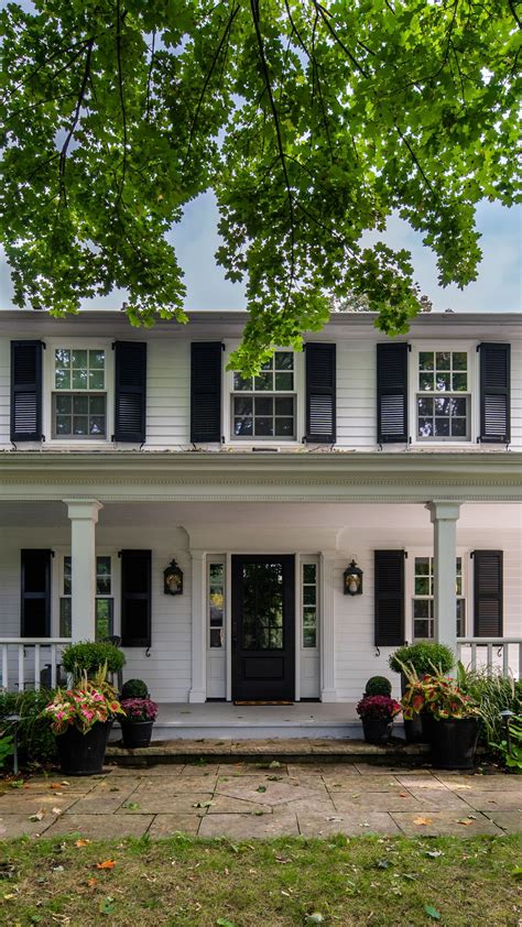 Charming White House with Classic Black Shutters