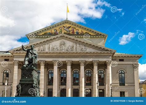 An arched neoclassical building with hanging PTT banners