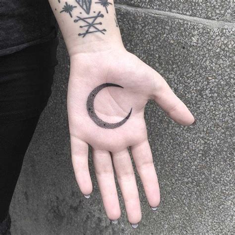 Crescent moon tattoo on the palm - Tattoogrid.net