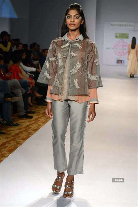 A model walks the ramp to showcase a creation by designer Nachiket ...