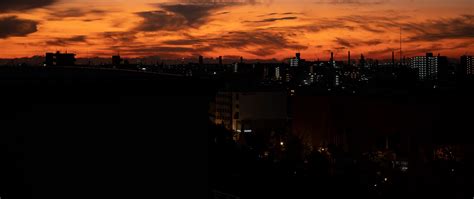 Download wallpaper 2560x1080 buildings, silhouettes, city, sunrise ...