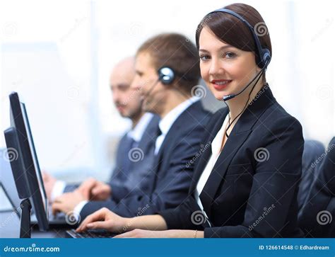 Female Customer Services Agent with Headset Working in a Call Center ...