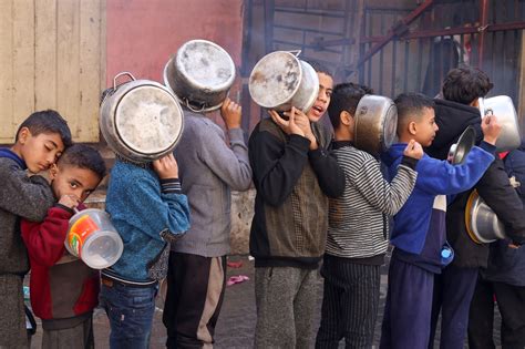 Gaza children dizzy from hunger as war impedes food deliveries | Reuters