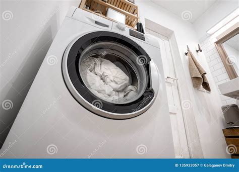 New Washing Machine with Bedding Inside, in the Interior of a Bright ...