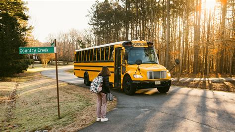 Child Riding A Bus To School