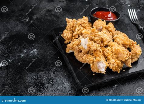 Crispy Fried Breadcrumb Covered Chicken Popcorn with Ketchup. Black ...