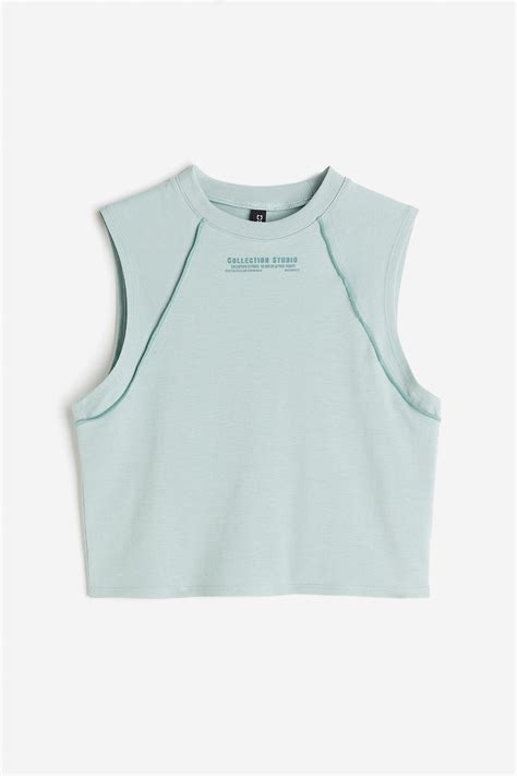 Cropped overlock-detail vest top - Light turquoise - Ladies | H&M IN