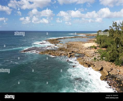 An aerial view of the sunny Shark's Cove, North Shore, Oahu, Hawaii ...