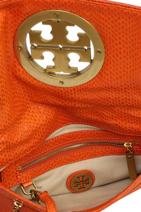 Tory Burch Orange Reva Clutch – Buy Pre-Loved Luxury at Retag.in