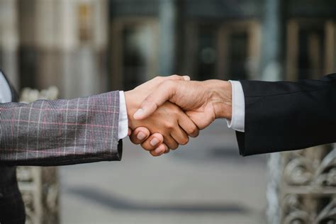 Two People Shaking Hands · Free Stock Photo