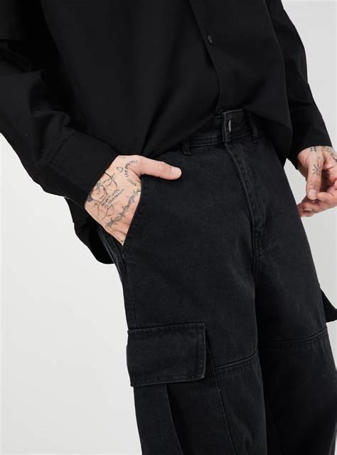 Buy Men Washed Loose Fit Cargo Jeans Online at just Rs. 1699.0 ...