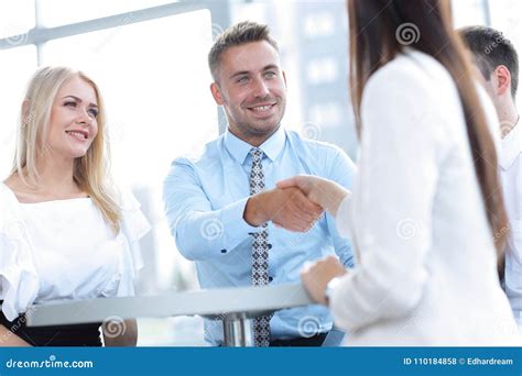 Closeup. Manager Shakes the Hand of a Woman Client. Stock Photo - Image ...