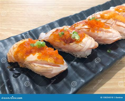 Set of Salmon Sushi Topped with Sweet Sauce and Salmon Roe Stock Photo ...