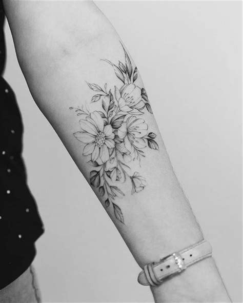 inner forearm floral tattoo