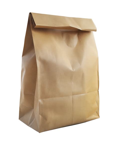 Brown paper lunch bag standing upright, closed at the top, on a ...