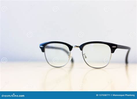 Close Up Side View Glasses on Desk Table Stock Image - Image of concept ...