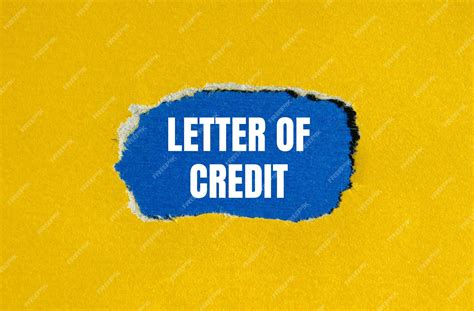 Letter of credit words written on ripped yellow paper with blue ...