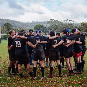 Team playing rugby and building resilience