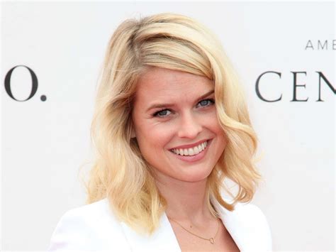 Download Alluring Alice Eve poses elegantly in a pink dress Wallpaper | Wallpapers.com