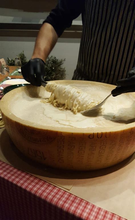 Spaghetti prepared in a 24M Parmigiano Reggiano wheel - Dining and Cooking