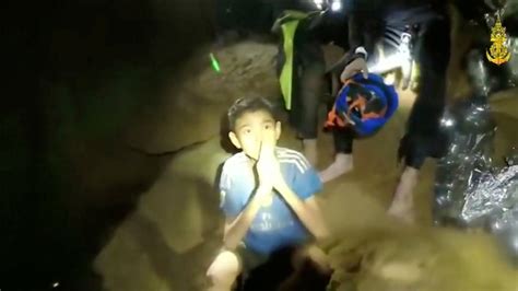 Boys from the under-16 soccer team trapped inside Tham Luang cave greet members of the Thai ...