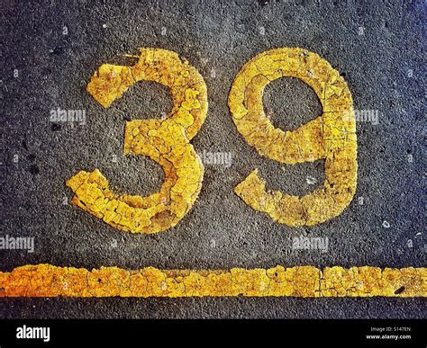 The Number 39 is painted on the Tarmac surface of a Car Park to help ...