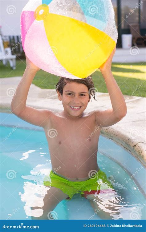 Close-up of Happy Male Kid with Big Ball in Swimming Pool Stock Photo ...