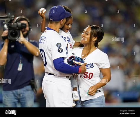 Los Angeles Dodgers right fielder Mookie Betts, left, poses for a photo ...