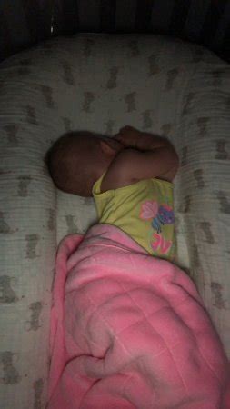 Baby arching back while sleeping | BabyCenter