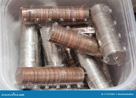 Rolls of coins and change stock image. Image of stash - 111975381