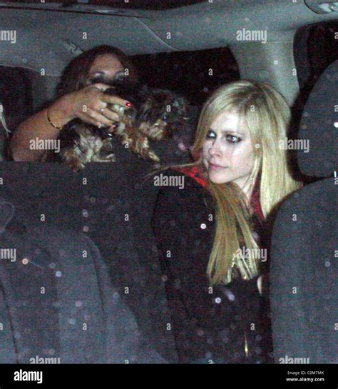 Avril Lavigne and husband Deryck Whibley leaving Koi where they dined ...