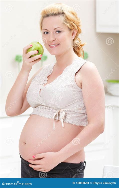 Pregnant Woman Eating Apple Stock Photo - Image of fruits, healthcare: 55088668