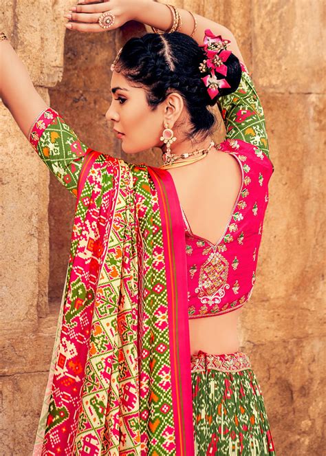 OLIVE GREEN HAND CRAFTED PATOLA SILK LEHENGA WITH EMBROIDERED SILK BLO ...