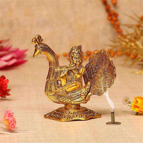 Buy Handicrafts Paradise Metal Krishna Playing Flute on a Peacock ...