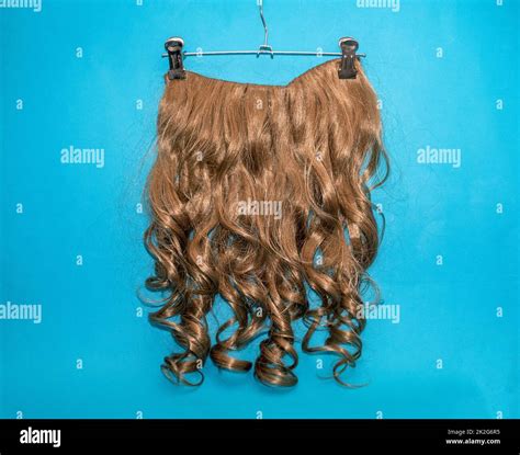 Dark blonde hair extension wig Stock Photo - Alamy