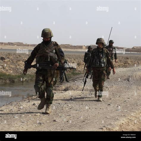 Helmand. 6th Dec, 2015. Afghan army soldiers walk during a military ...