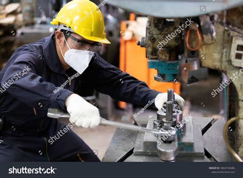 Image result for An Engineer Fixing Machine